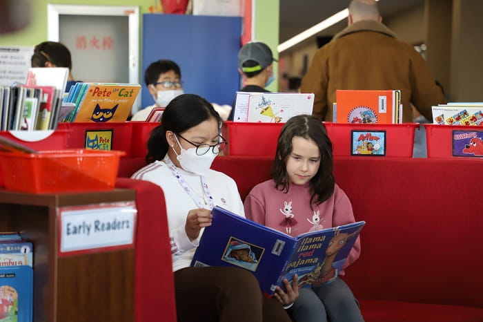 Buddy reading in elementary school library
