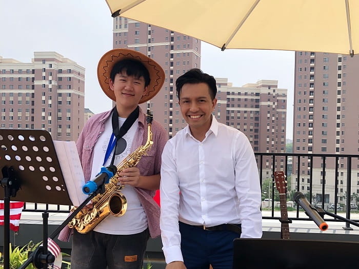 Raymond plays the saxophone