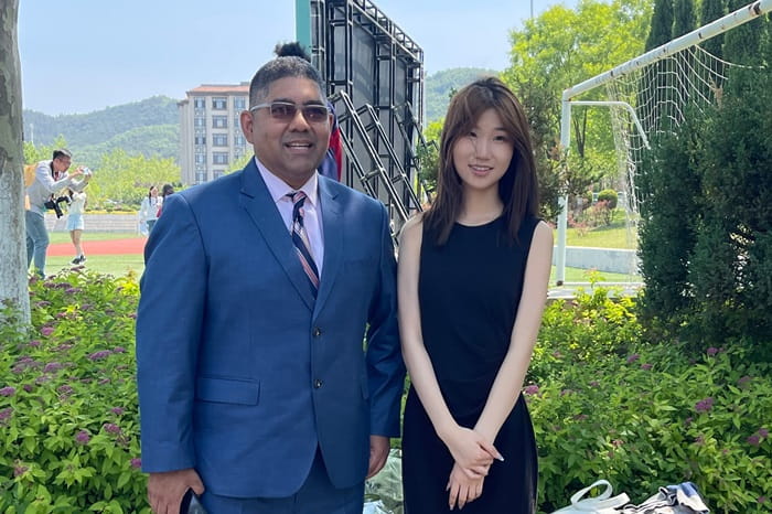 Student with her science teacher