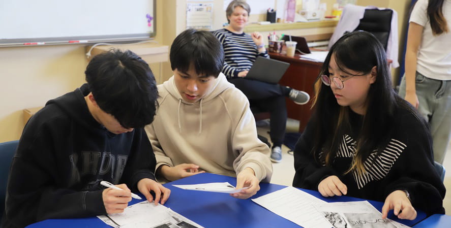 High school students solving a puzzle