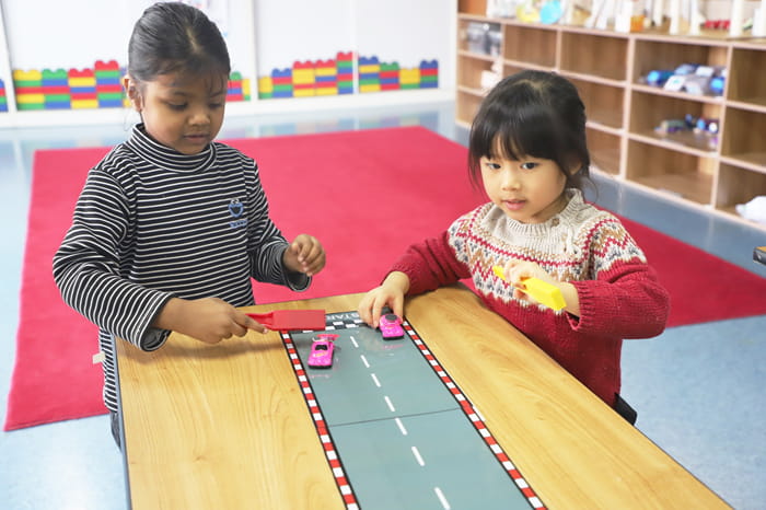Pre-K students exploring magnets during their STEAM class