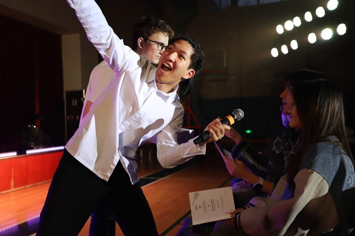 Show emcees working with the audience