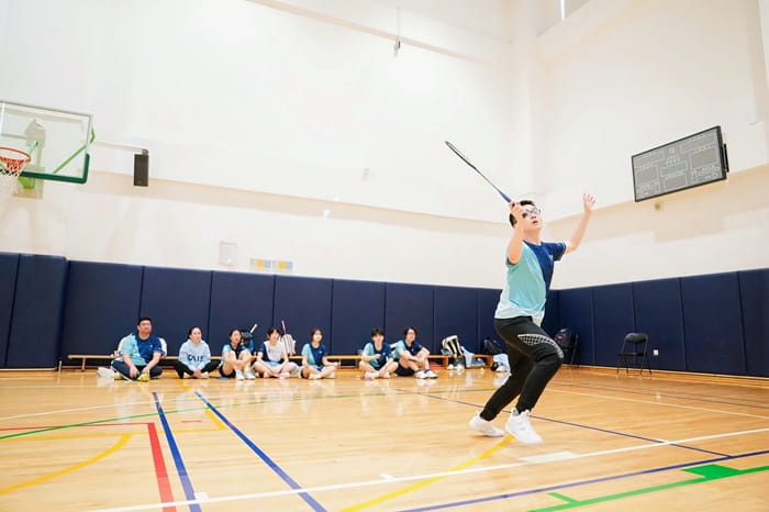 Boy playing badminton
