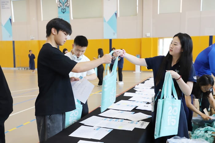 student receiving a welcome back to school package