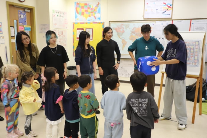High school seniors and early years students play together