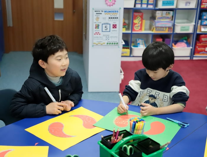 Students drawing a fish