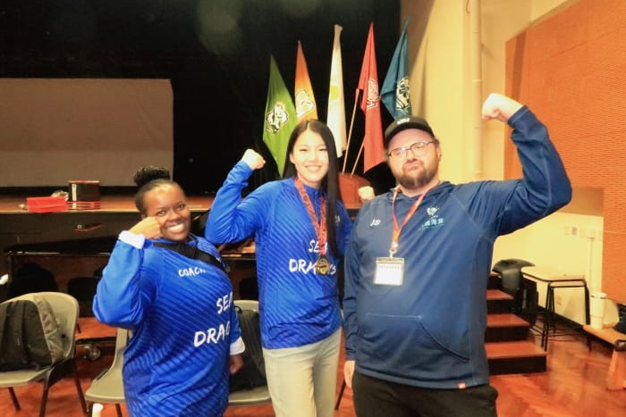 Anna with the baskteball coaches, Ms. Judy and Mr. Singleton