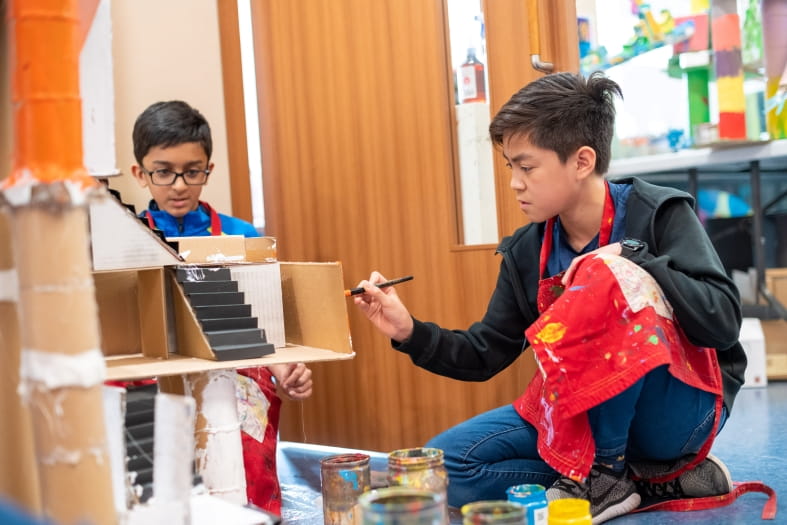 two boys demonstrate creativity and human connection