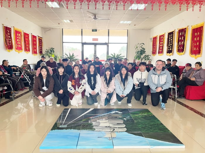 students visiting a nursing home to help elderly